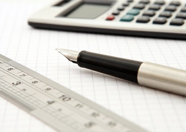 pen, calculator and ruler